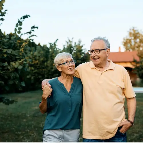 embraced-senior-couple-walking-through-their-backyard.jpg_s1024x1024wisk20cH7G58MfBJWFHNy9VAJ0EF3081i1gVa4Xv_EDWDUEozQ